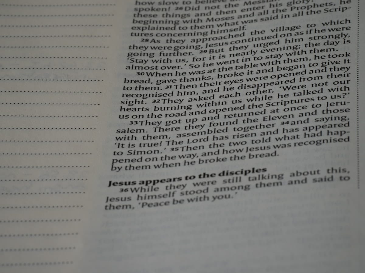 A close up of an open book with writing on it