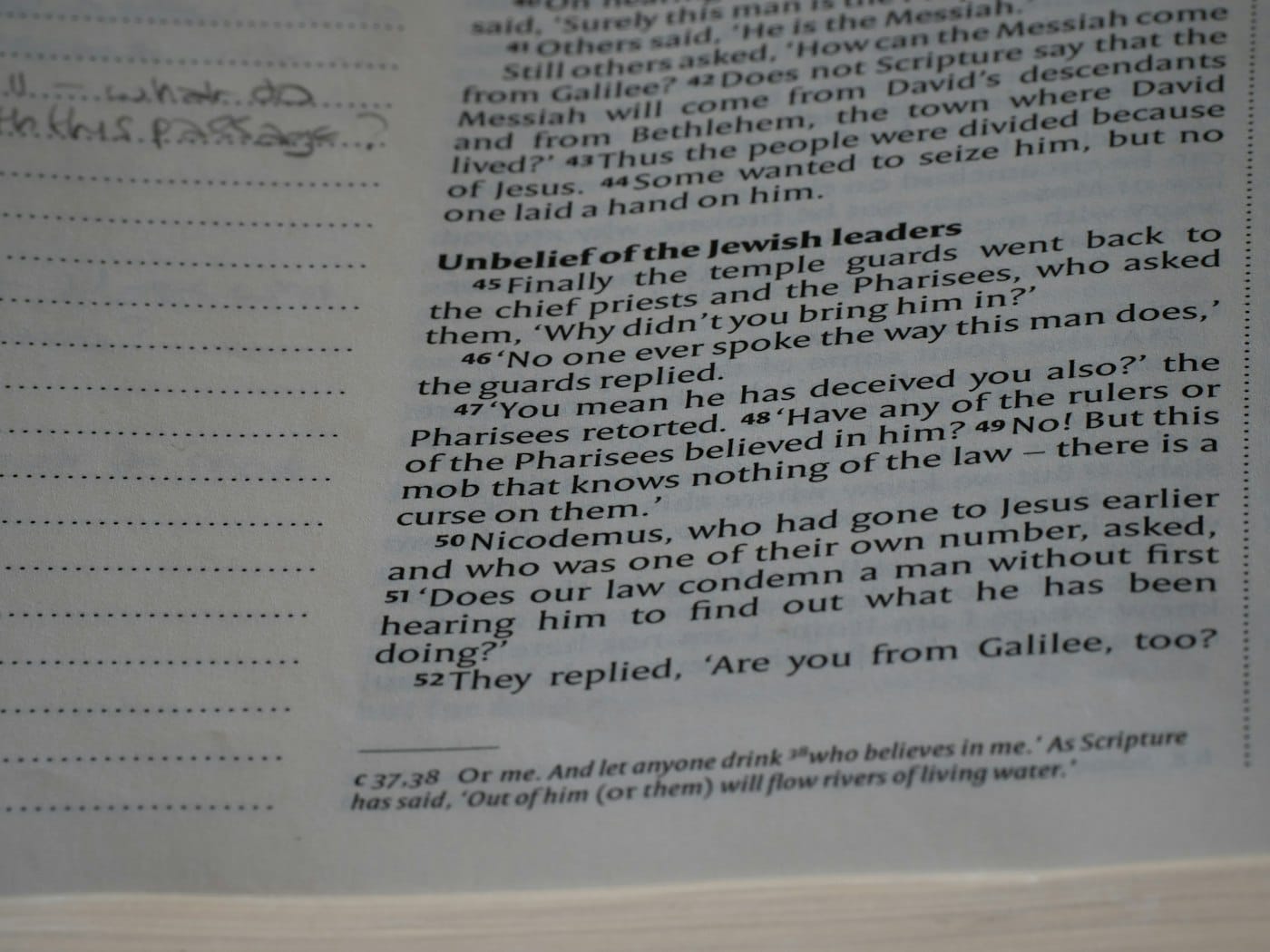 A close up of an open book with writing on it