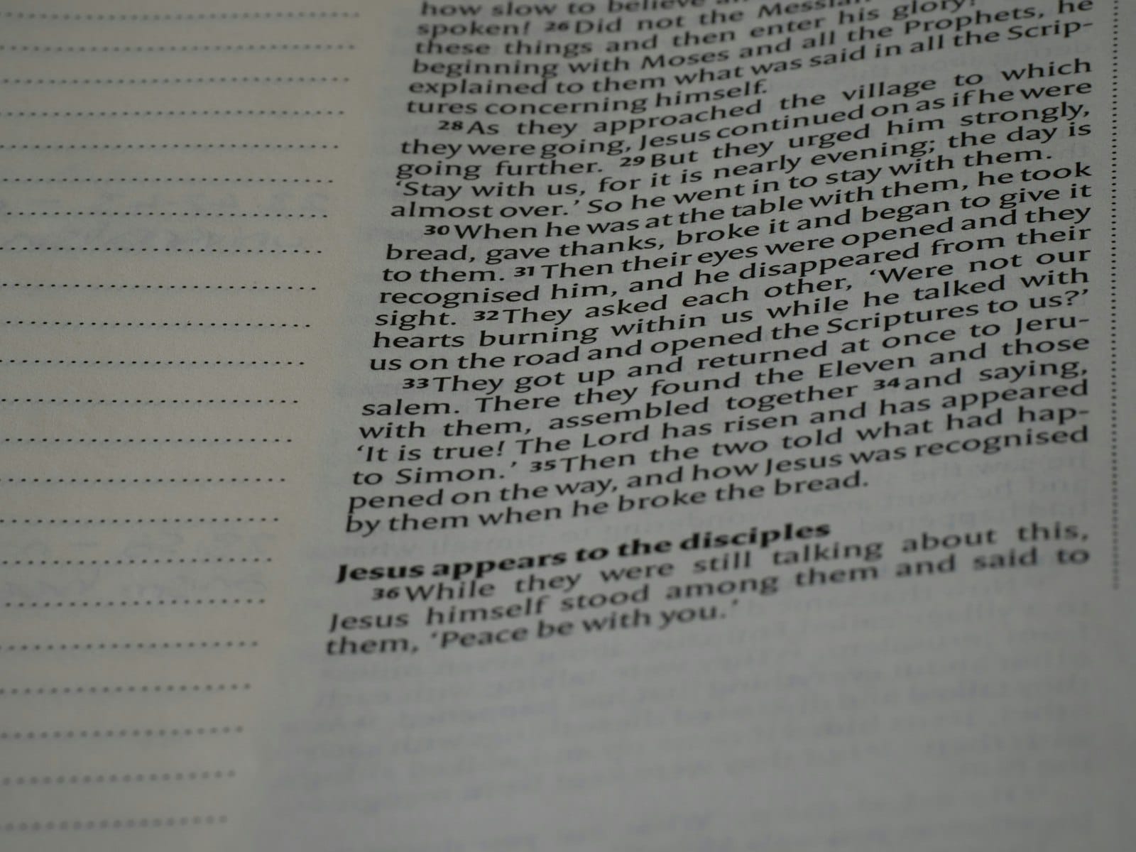 A close up of an open book with writing on it